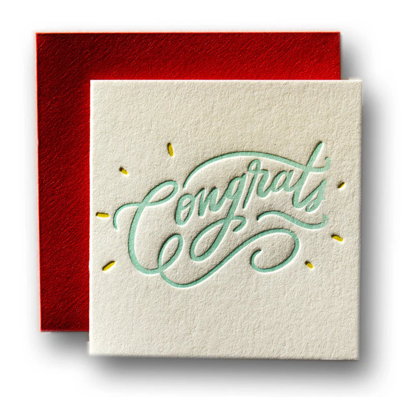A letterpress Congrats card with script and highlights and a red envelope.