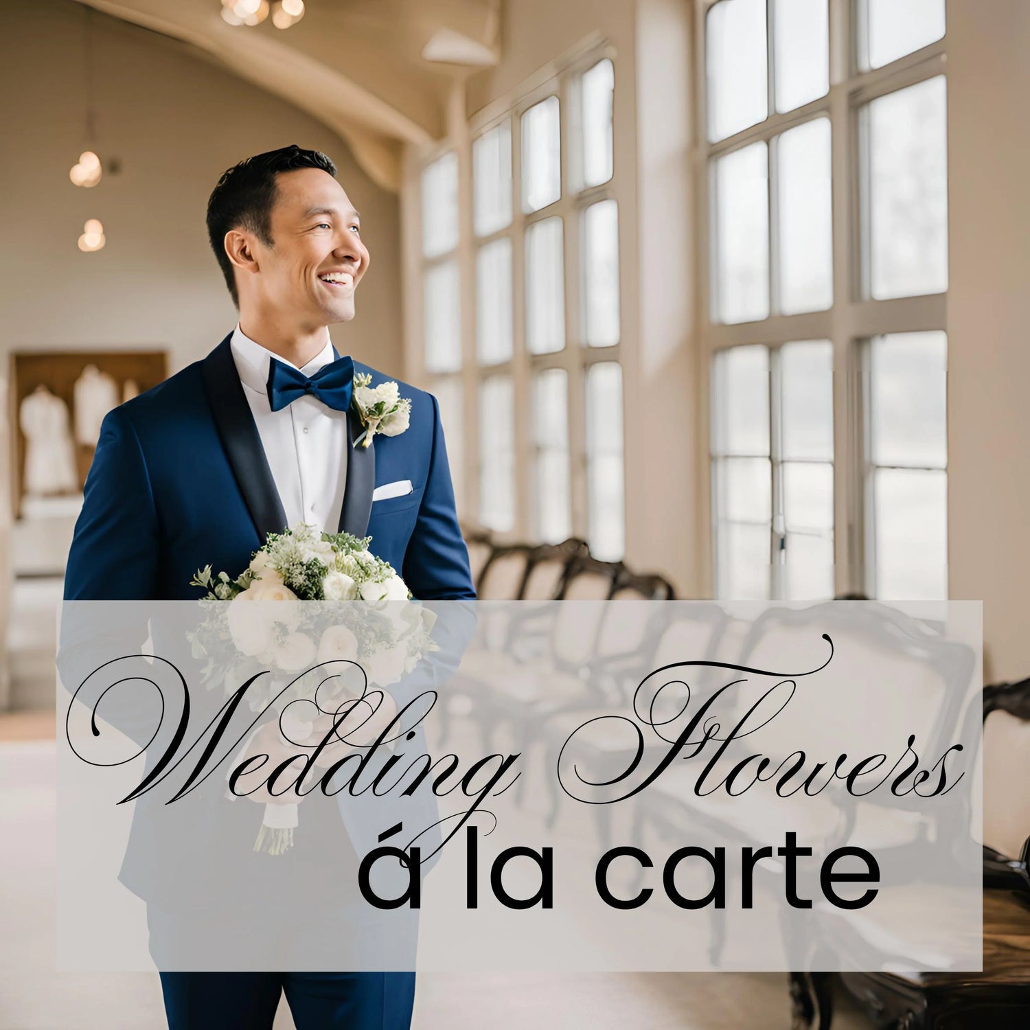 Smiling groom in navy tuxedo holding elegant white wedding bouquet in bright wedding venue